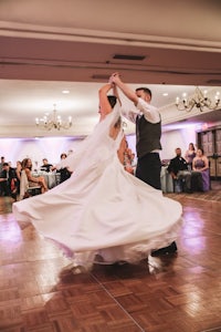 a bride and groom dancing at their wedding reception